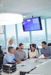 High angle vierw of business partners discussing in meeting at office desk